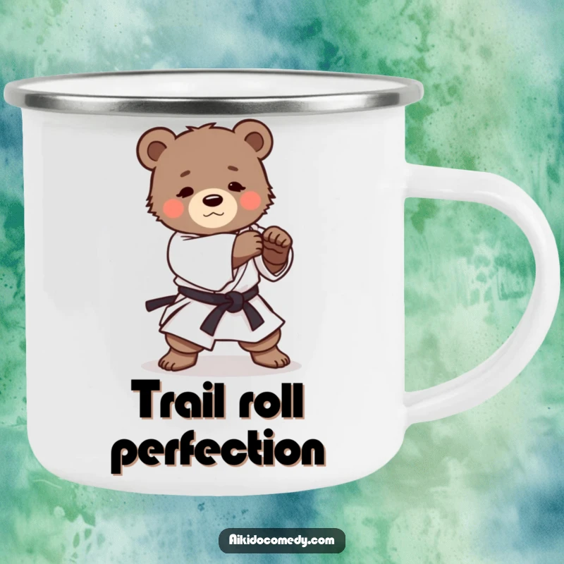 Funny camping mug showing a determined bear cub in martial arts attire practicing a gentle Aikido roll, ready for outdoor use.