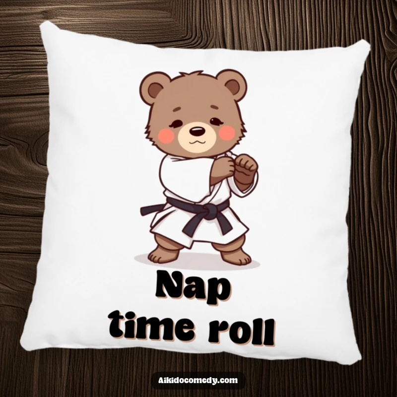 Funny pillow with a determined bear cub in a gi practicing a gentle Aikido roll, offering comfort and a humorous visual.