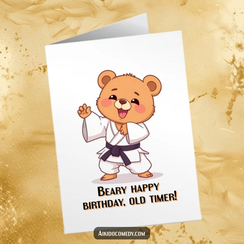Funny Free Printable Birthday Card featuring a happy bear cub in a gi, enthusiastically striking a playful Aikido pose.
