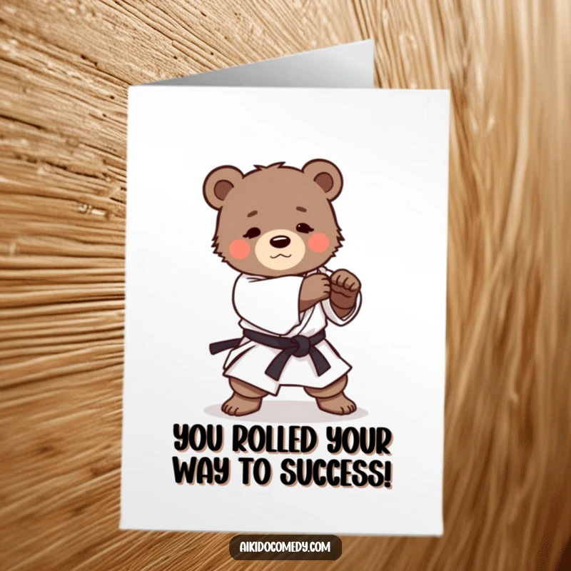 Funny Free Printable Congrats Card showing a determined bear cub in a gi executing a gentle Aikido roll, celebrating success.