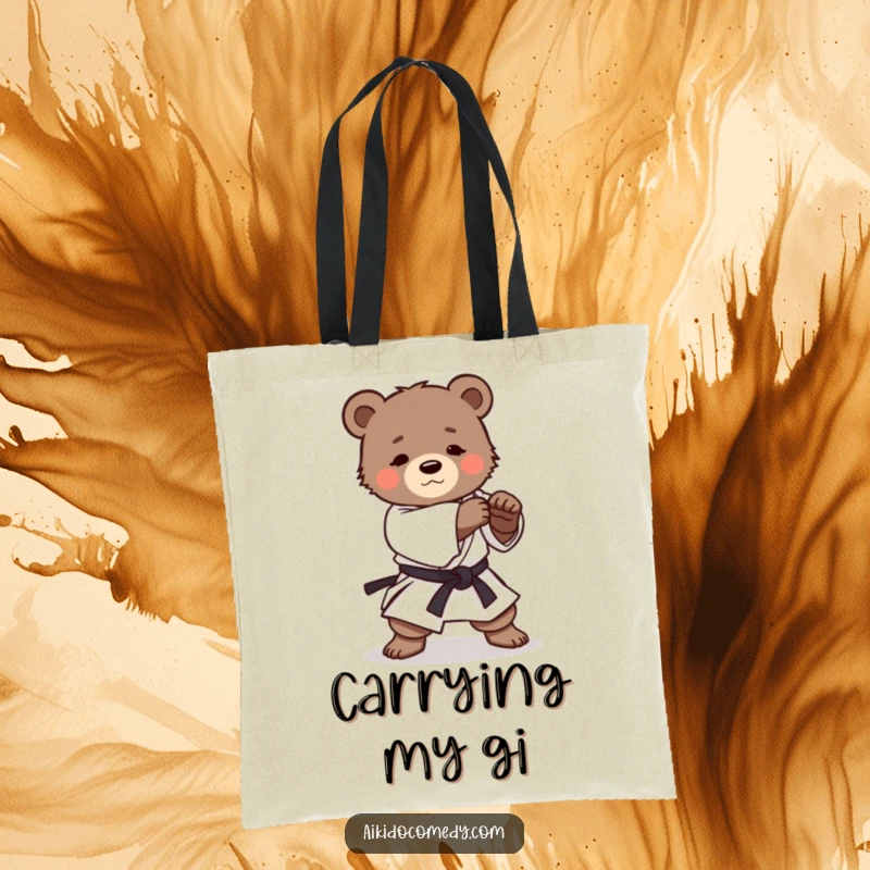 Funny tote bag depicting a small, determined bear cub in a gi practicing a gentle Aikido roll, perfect for carrying daily items.